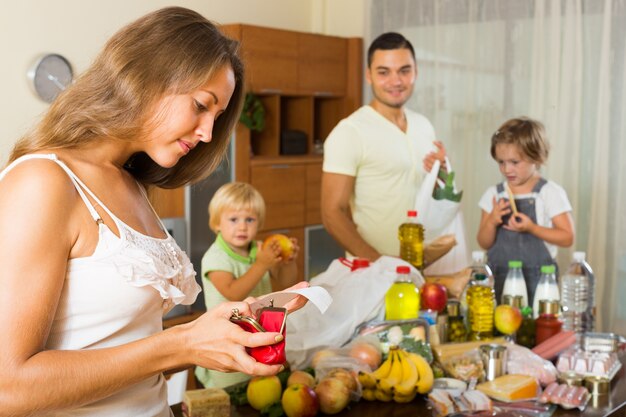 Poor family with bags of food