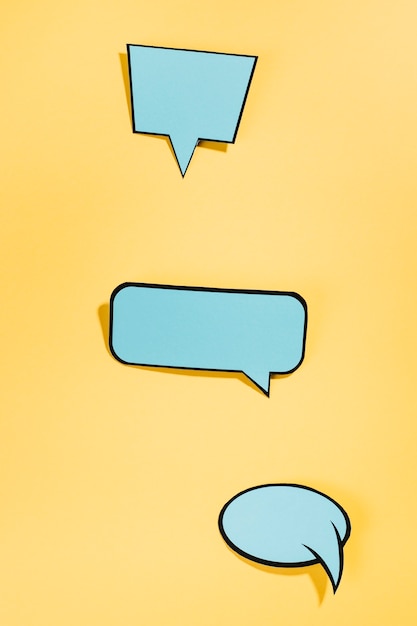 Pop art style speech bubbles on yellow backdrop