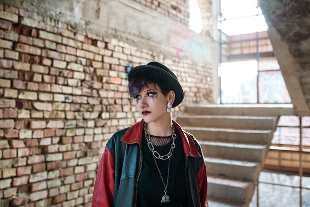 Pop punk aesthetic portrait of woman posing inside building