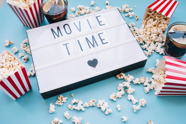 Free photo popcorn box with a cinema sign