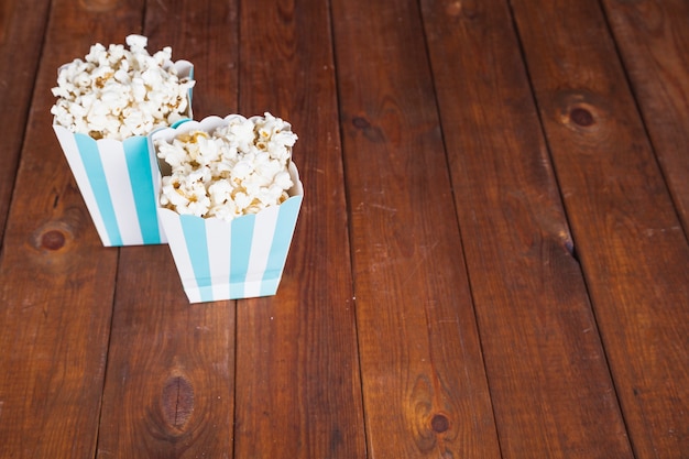 Popcorn boxes on wooden tabletop