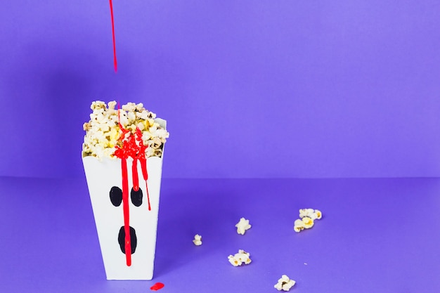 Free photo popcorn carton with ghost face