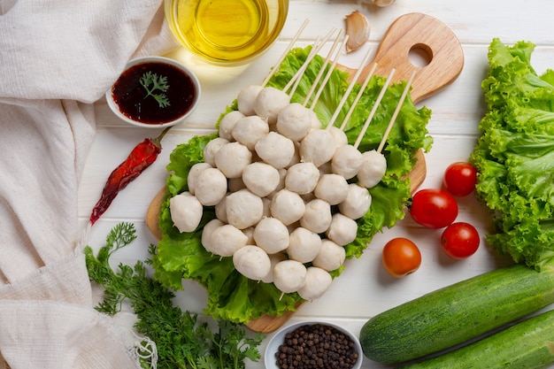 Free Photo pork meatballs on the white wooden surface.