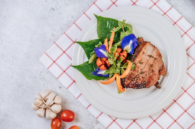 Pork Steak with Tomato, Carrot, Red Onion, Peppermint, Butterfly Pea Flower, and Lime.