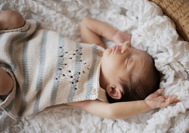 Free photo portrait of adorable little baby taking a nap