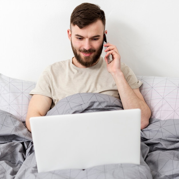 Free photo portrait of adult male enjoying work from home