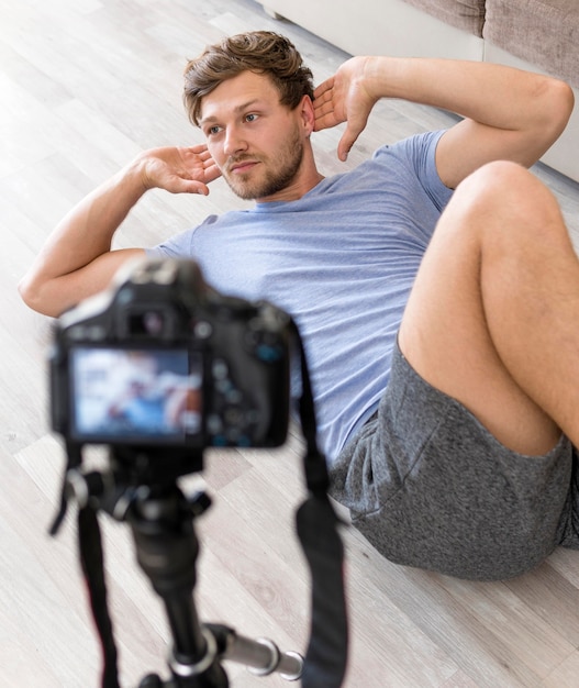 Portrait of adult male exercising at home