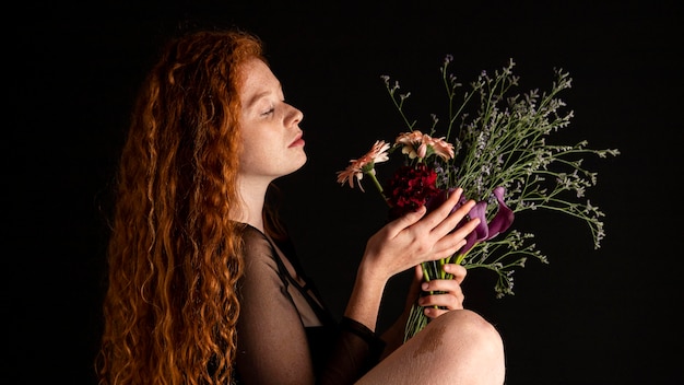 Portrait of adult woman with colorful flowers