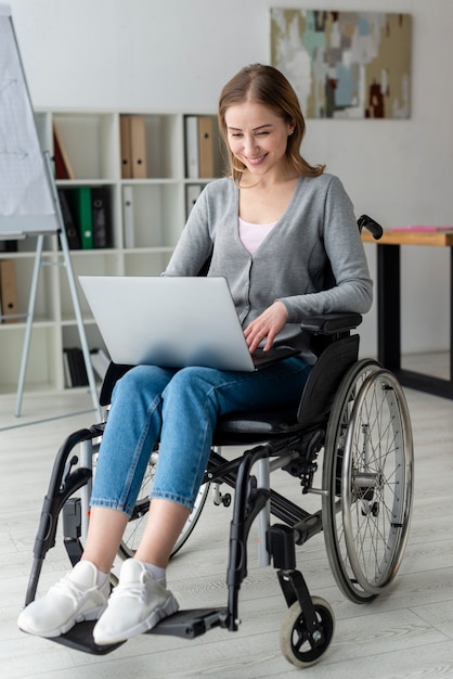 Portrait of adult woman working on a laptop