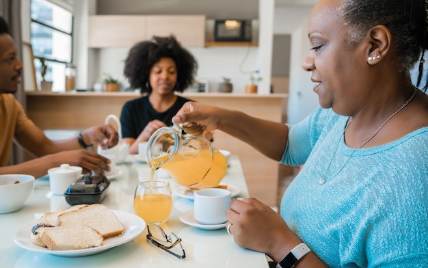 Portrait of African american family having breakfast together at home. Family and lifestyle concept.