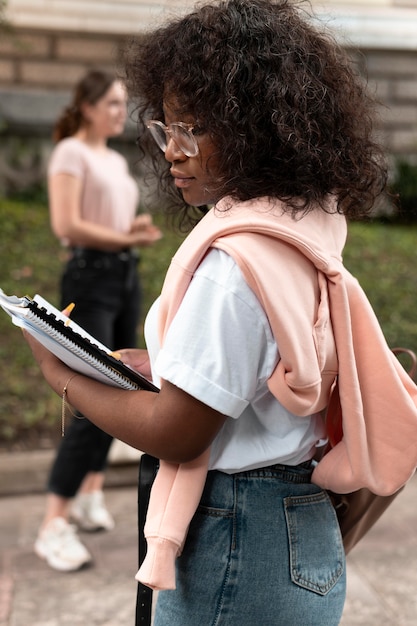 Portrait of african american girl with her books