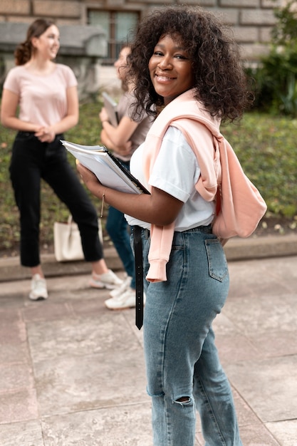 Portrait of african american girl with her books