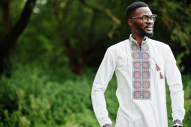 Portrait of african man in traditional clothes at park