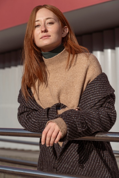 Portrait of alluring woman posing outside