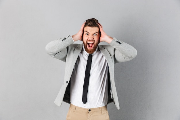 Portrait of an angry businessman dressed in suit