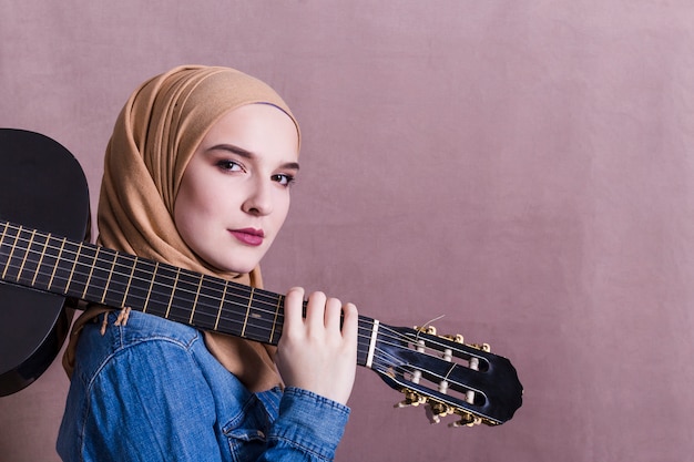 Free Photo portrait of arab woman with guitar