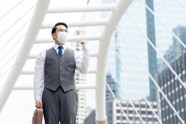 Portrait asian business man wearing protective face mask for protection during the quarantine