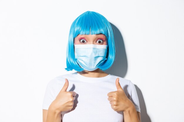 Portrait of an Asian girl in a blue short wig