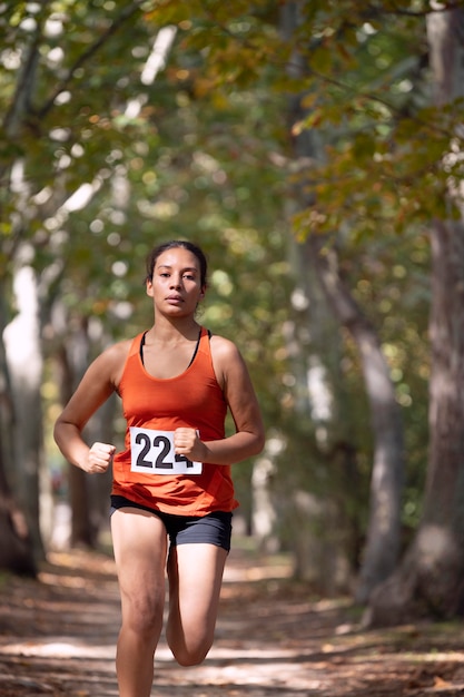 Portrait of athletic woman participating in a cross country