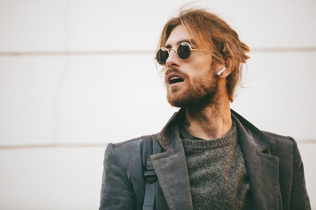 Portrait of an attractive bearded man wearing sunglasses