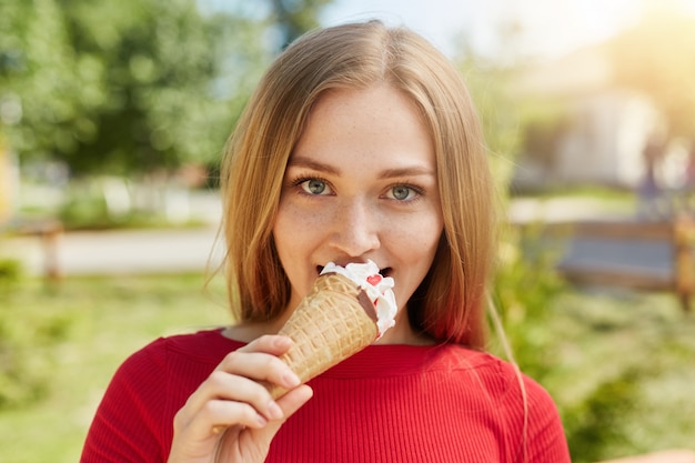 Portrait of attractive blonde female with warm shining eyes