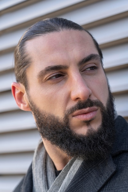 Portrait of attractive man posing outside