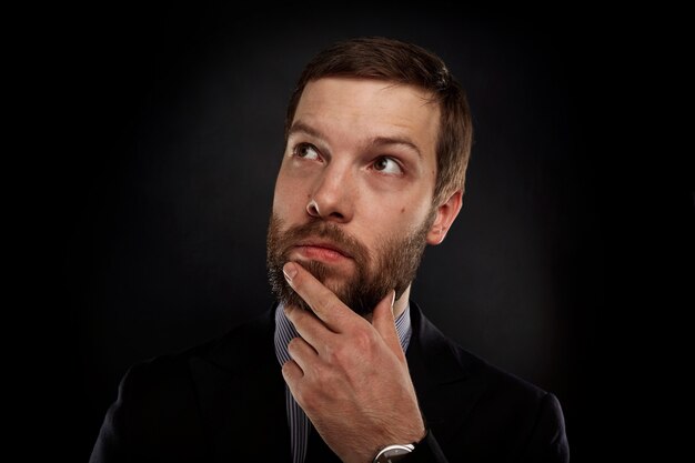 Portrait of bearded man wearing formal clothes