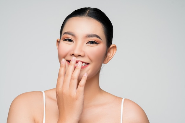 Portrait of beautiful asian woman with black hair and pink lips