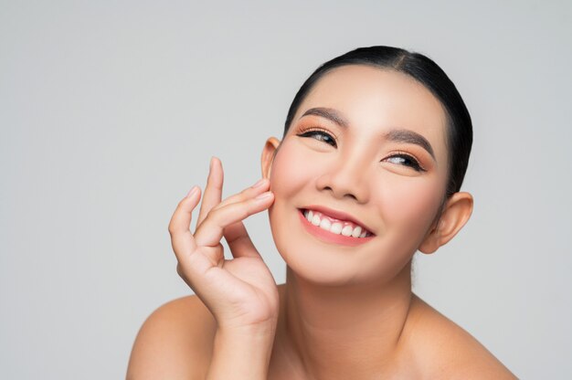 Portrait of beautiful asian woman with black hair and pink lips