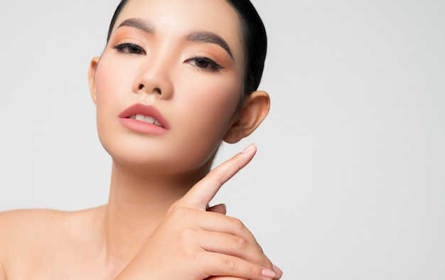 Portrait of beautiful asian woman with black hair and pink lips