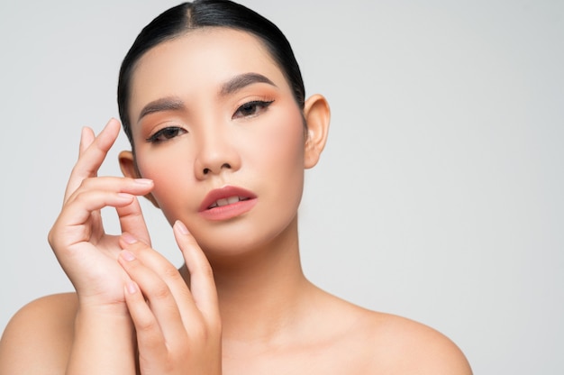 Portrait of beautiful asian woman with black hair and pink lips