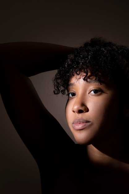 Free Photo portrait of beautiful black woman with mysterious shadows