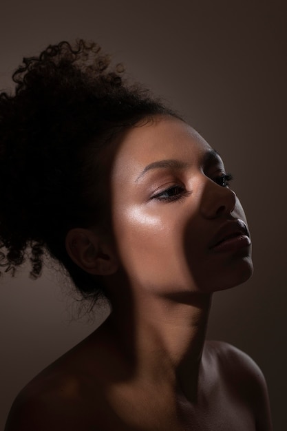 Portrait of beautiful black woman with mysterious shadows