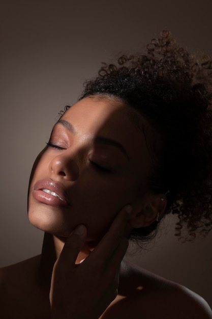 Portrait of beautiful black woman with mysterious shadows