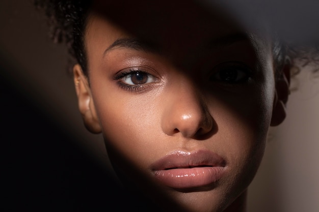 Portrait of beautiful black woman with mysterious shadows