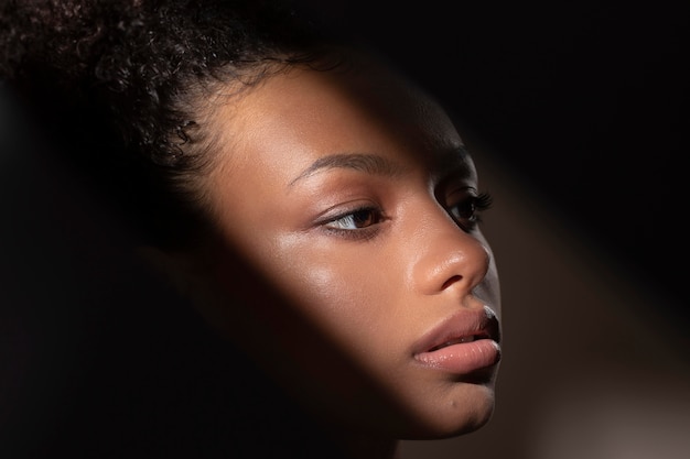 Portrait of beautiful black woman with mysterious shadows