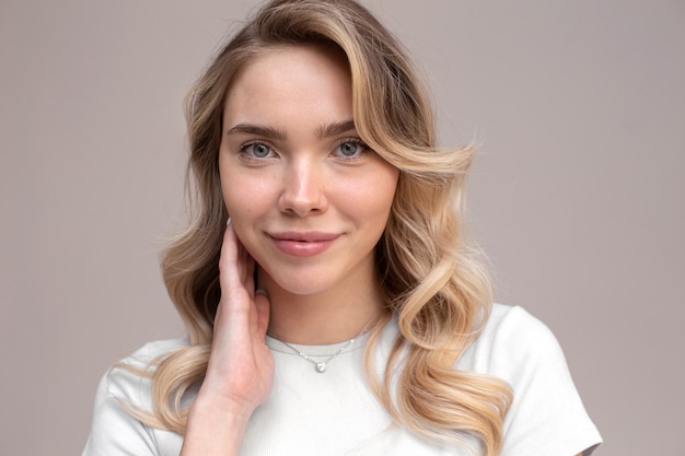 Portrait of beautiful blond woman with trendy hairstyle