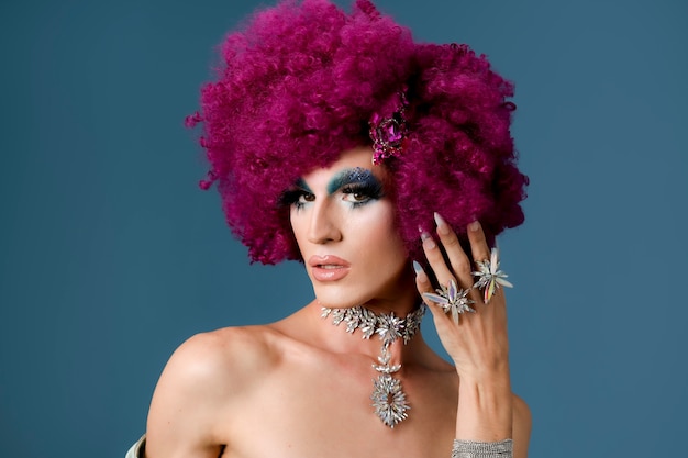 Portrait of beautiful drag person wearing makeup and wig