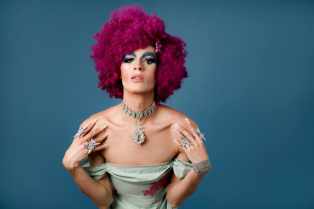 Portrait of beautiful drag person wearing makeup and wig