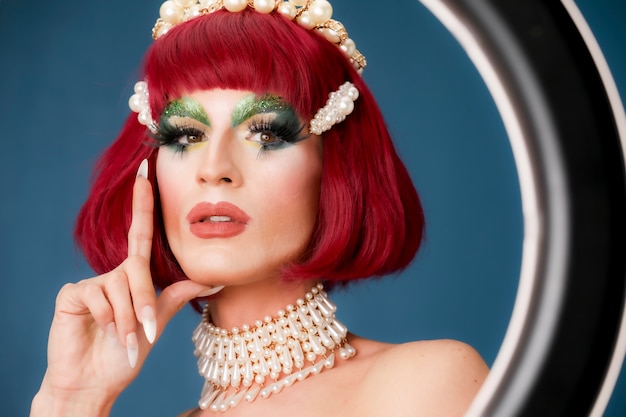 Portrait of beautiful drag person wearing makeup and wig