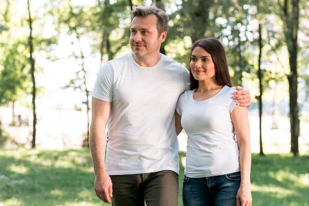 Free Photo portrait of beautiful loving couple standing in garden