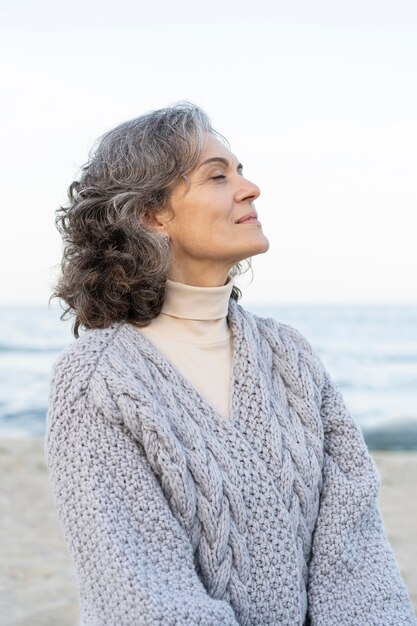 Portrait of beautiful older woman at the beach