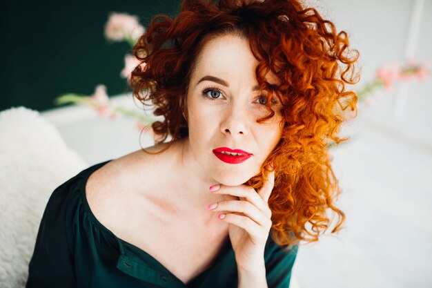 Portrait of a beautiful and red-haired young woman