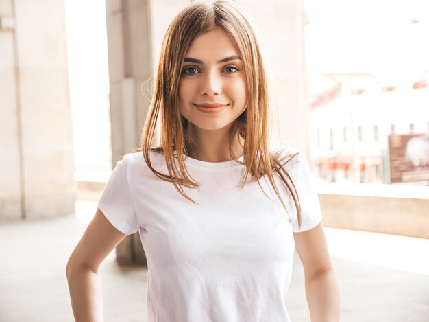 Portrait of beautiful smiling blond model dressed in summer hipster  clothes.  