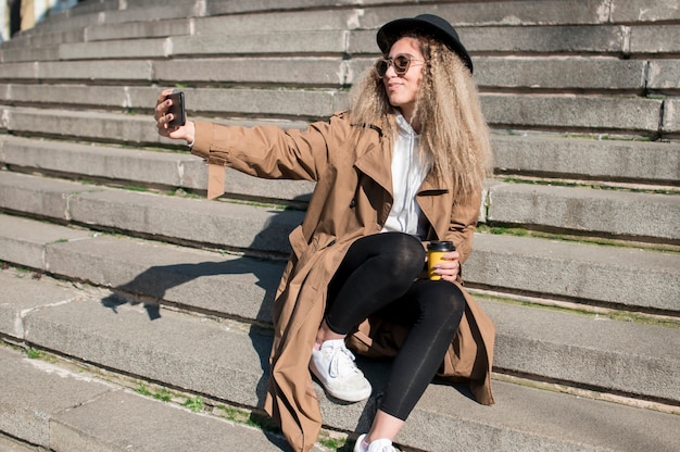 Free Photo portrait of beautiful teenager taking a selfie