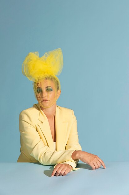 Portrait of beautiful woman posing with an avantgarde head piece