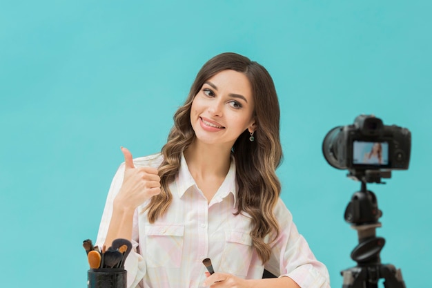 Portrait of beautiful woman recording video