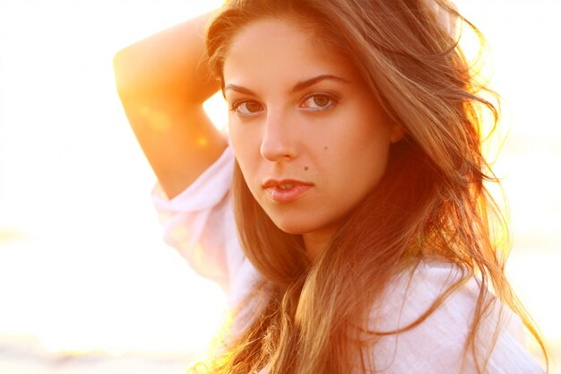 Portrait of beautiful woman in sunset light