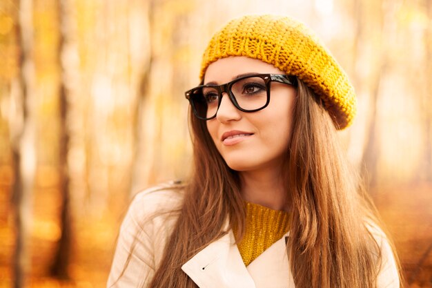 Portrait of beautiful woman wearing fashion glasses during the autumn