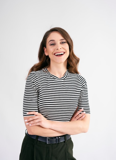 Portrait of beautiful woman with arms crossed